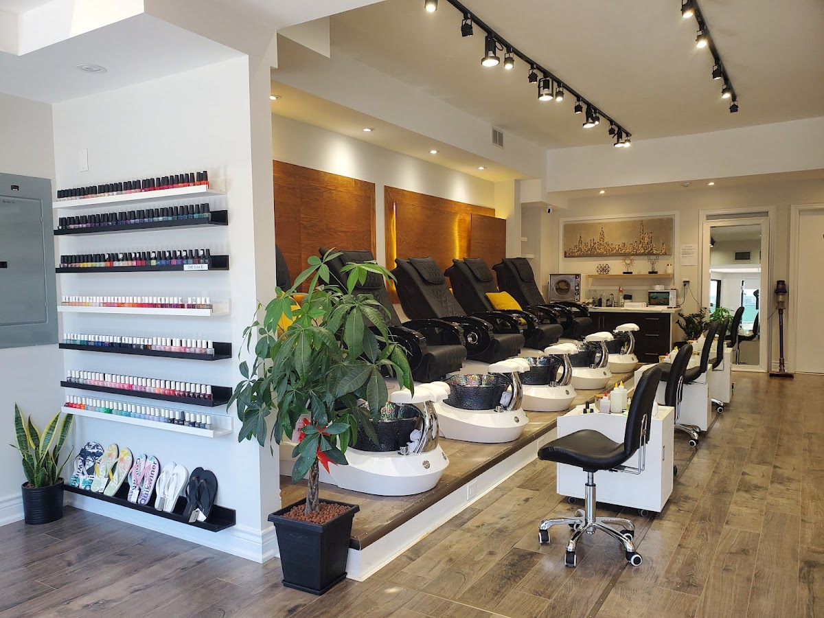 Inside Dy Nail Studio, bright and modern salon with pedicure chairs