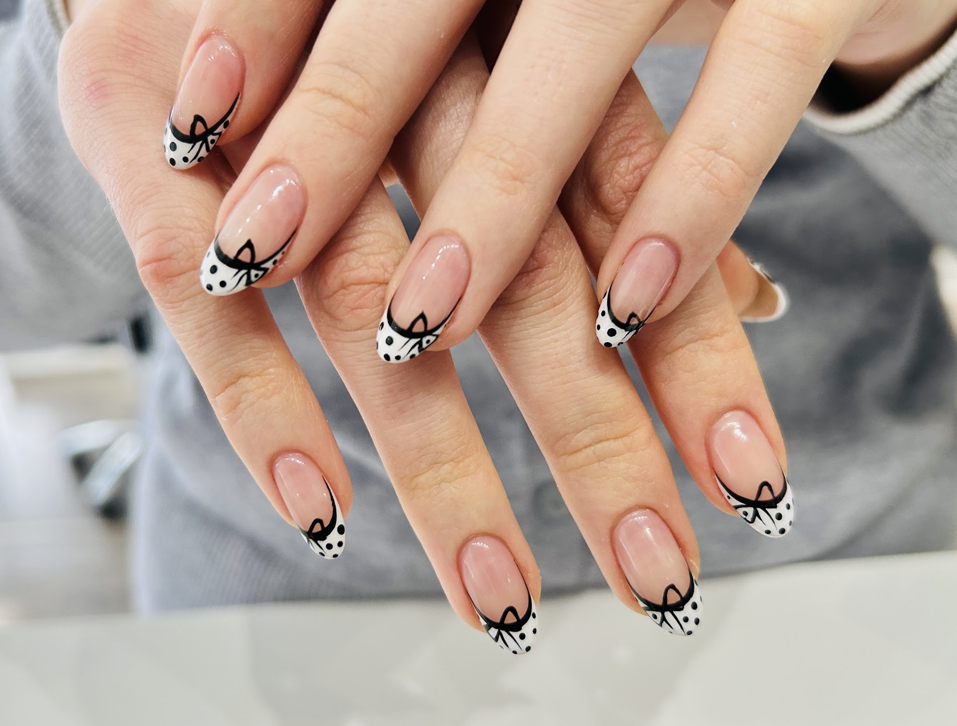 French tips with black bows and polka dots