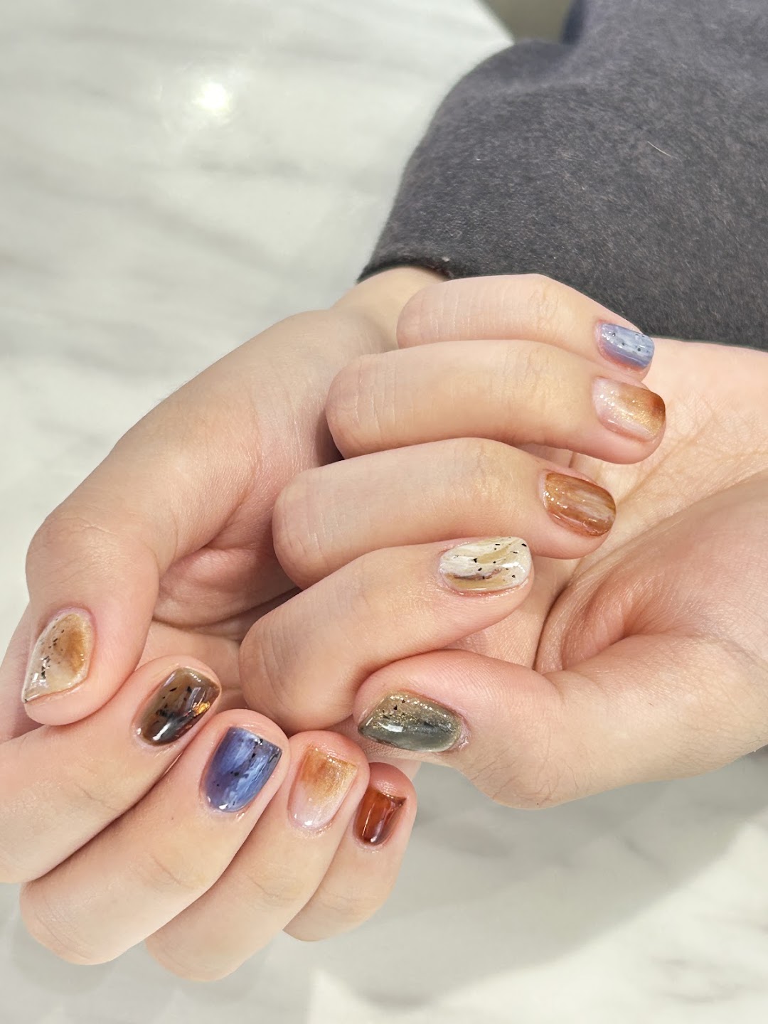 Multicolor short nail art on both hands