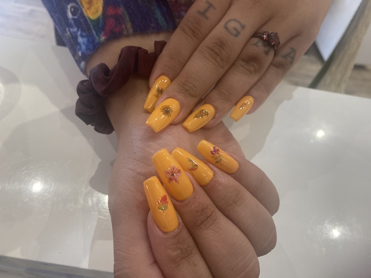 Orange floral nail art by customer