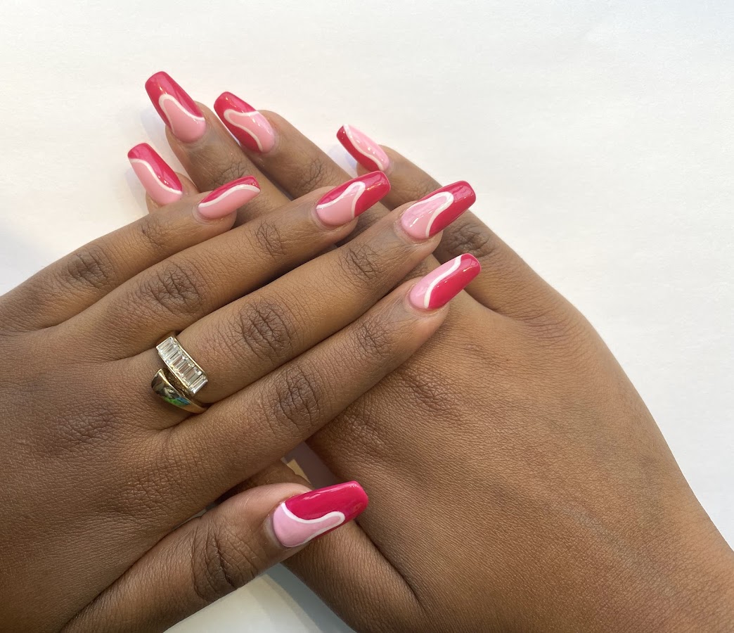 Pink swirl manicure on both hands