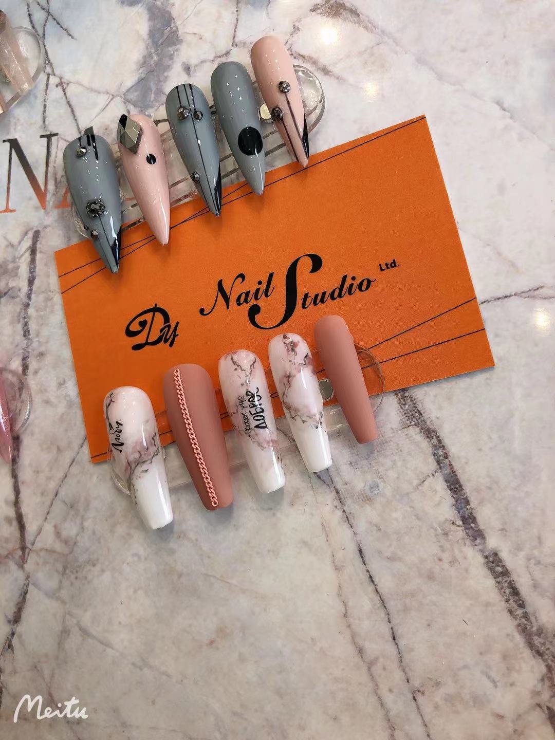 Nail art sample tips on salon card